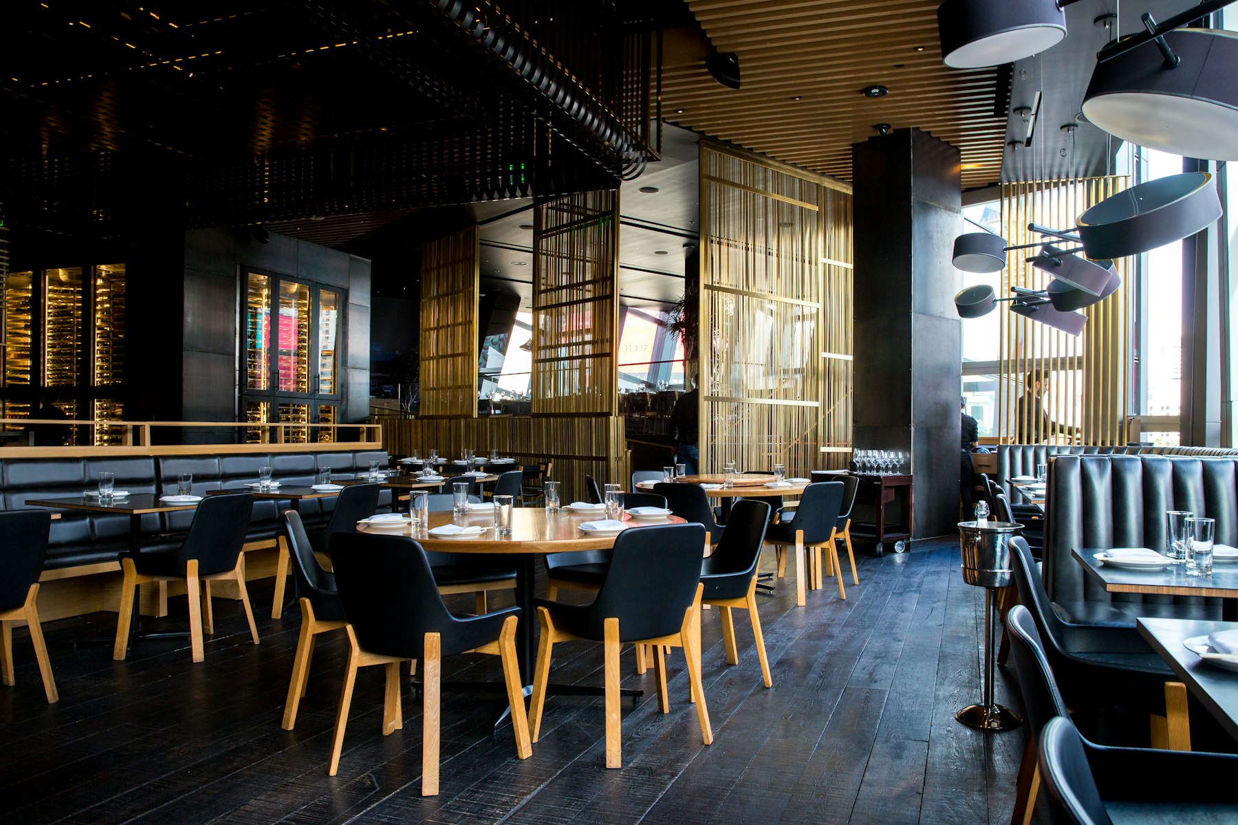 The kitchen's open pass, copper pans and evening service underway