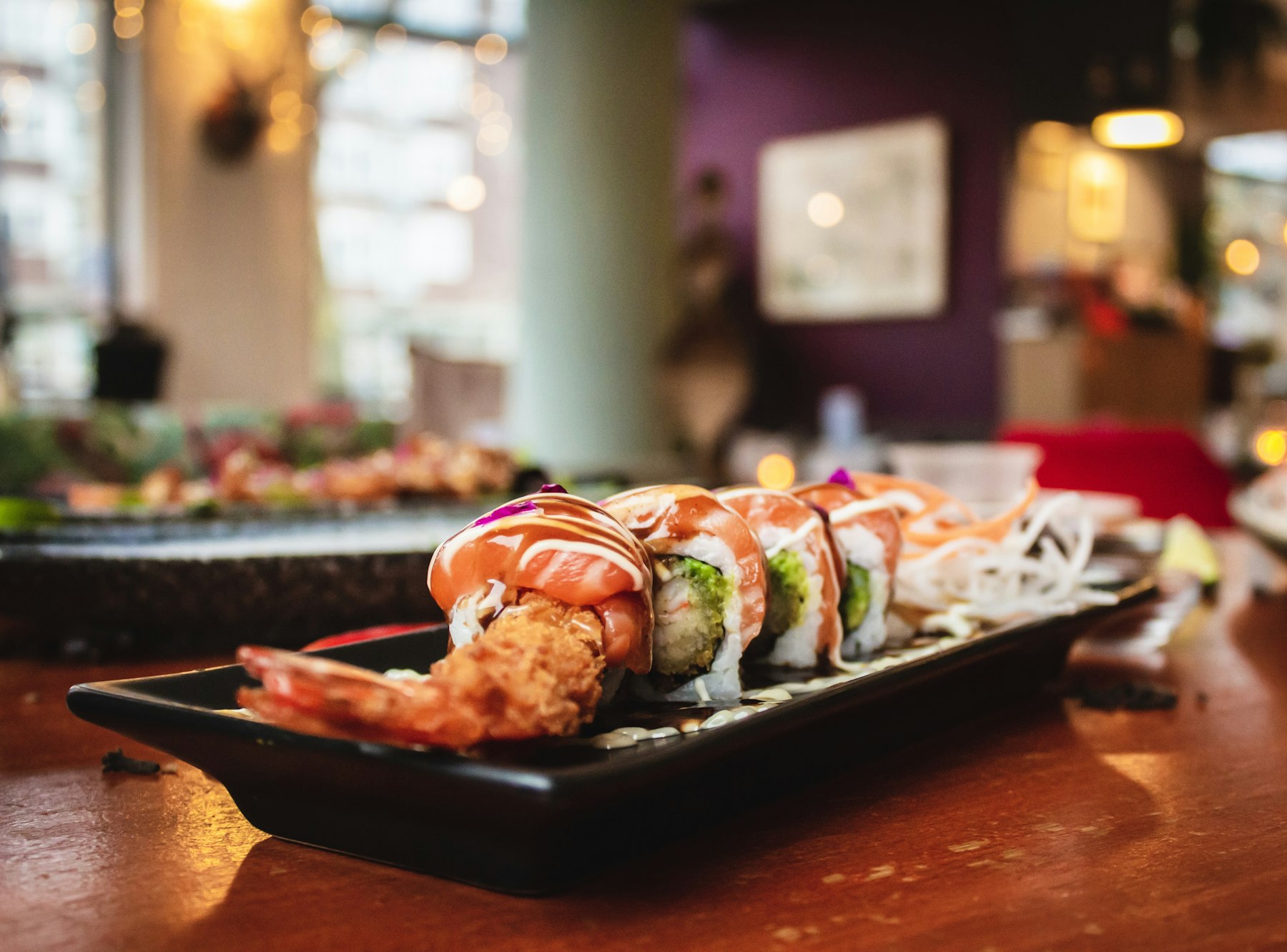A sushi platter at a counter restaurant