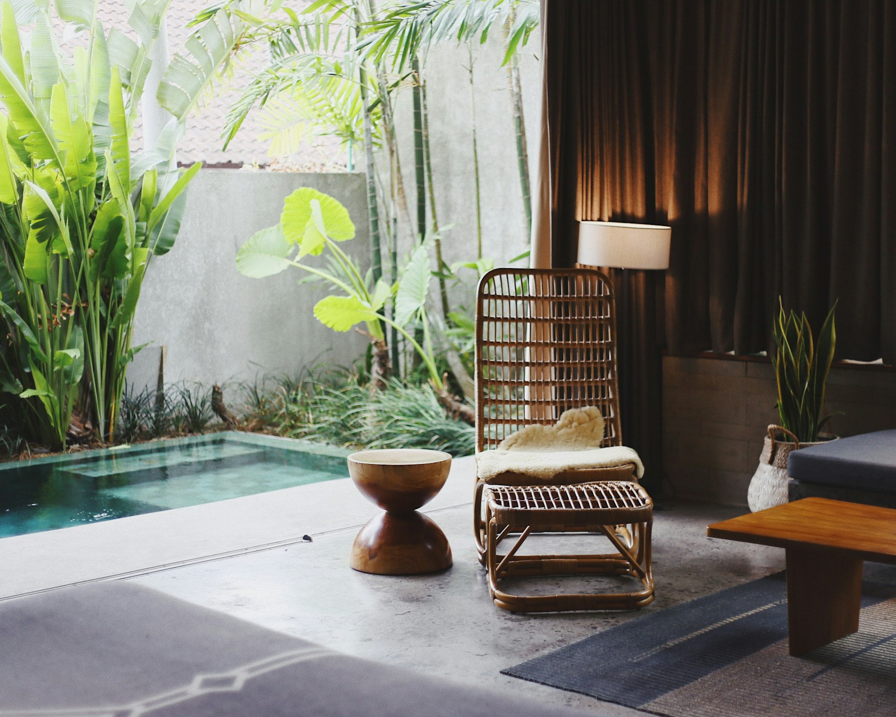 The courtyard plunge pool between curtained cabanas