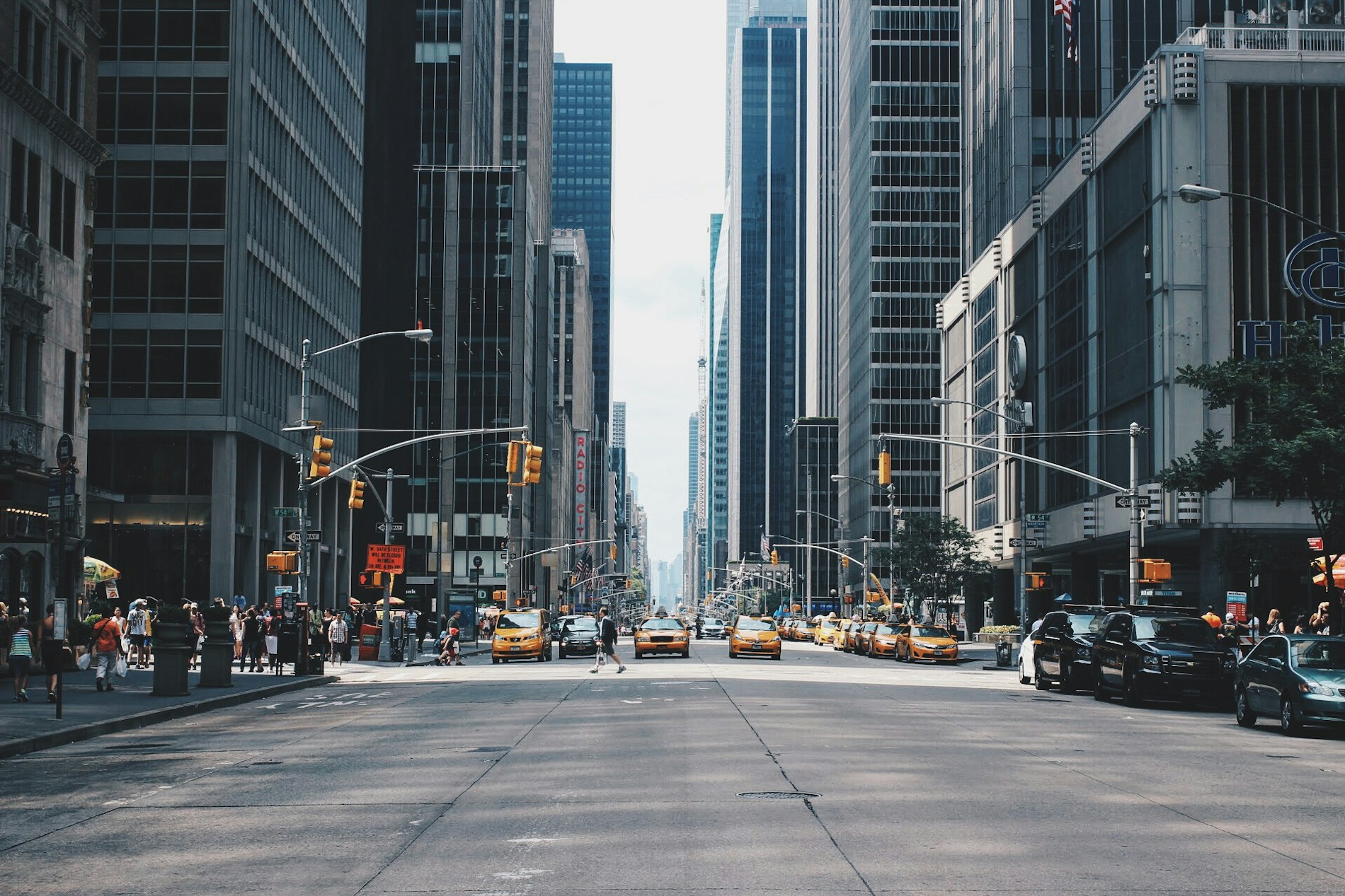 A city street canyon between towers