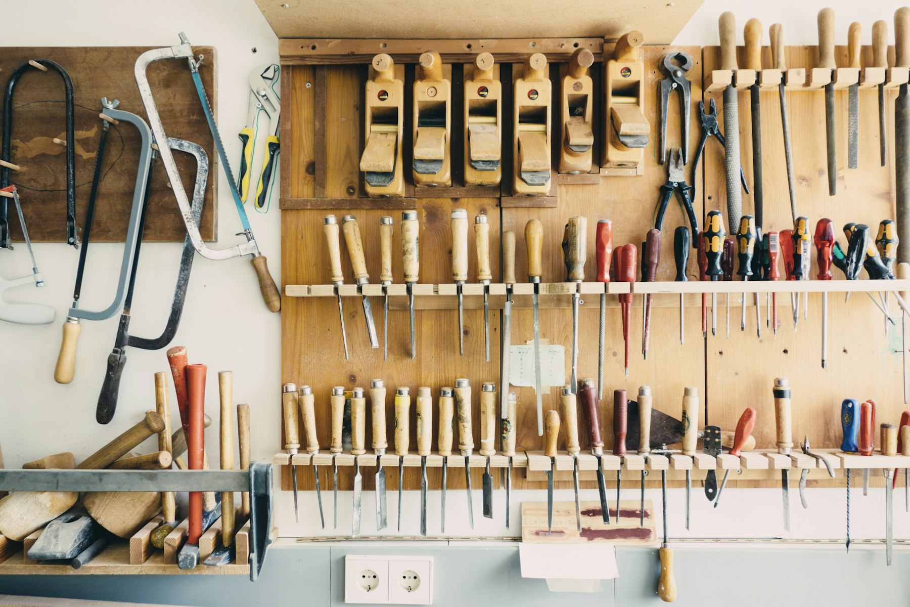 A wall of well-kept hand tools
