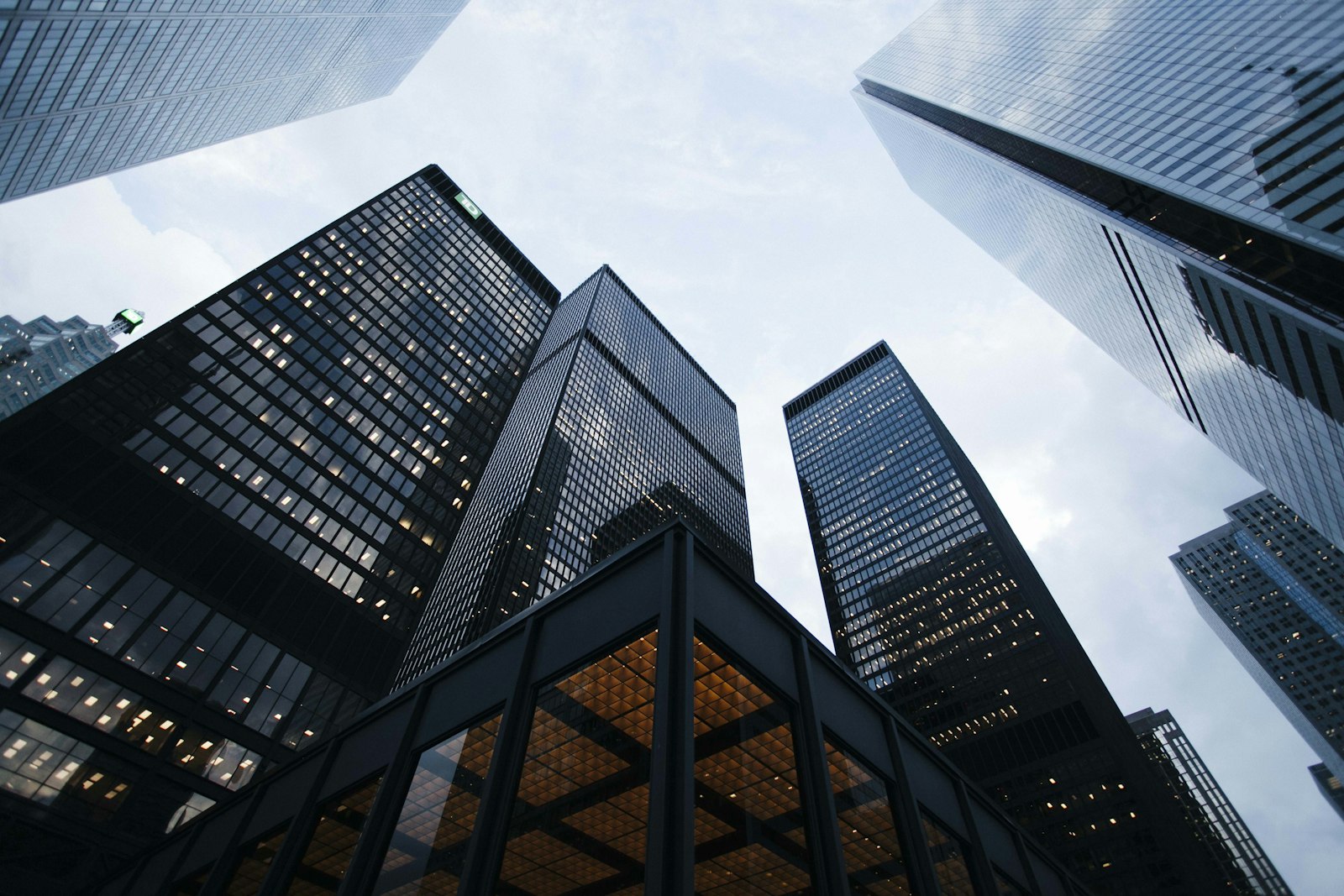 Dark office towers photographed from below