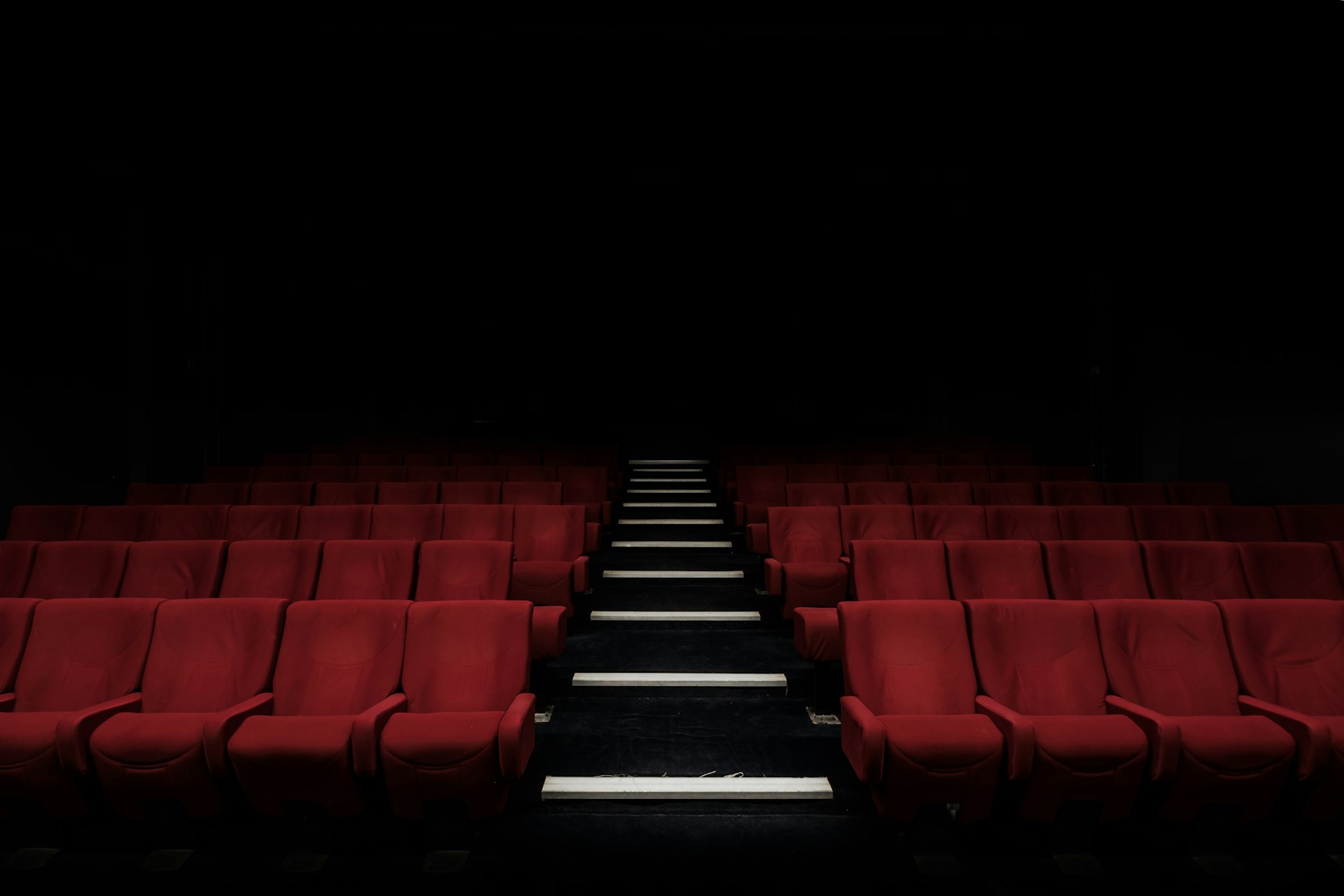 The screening room, eighteen red velvet seats