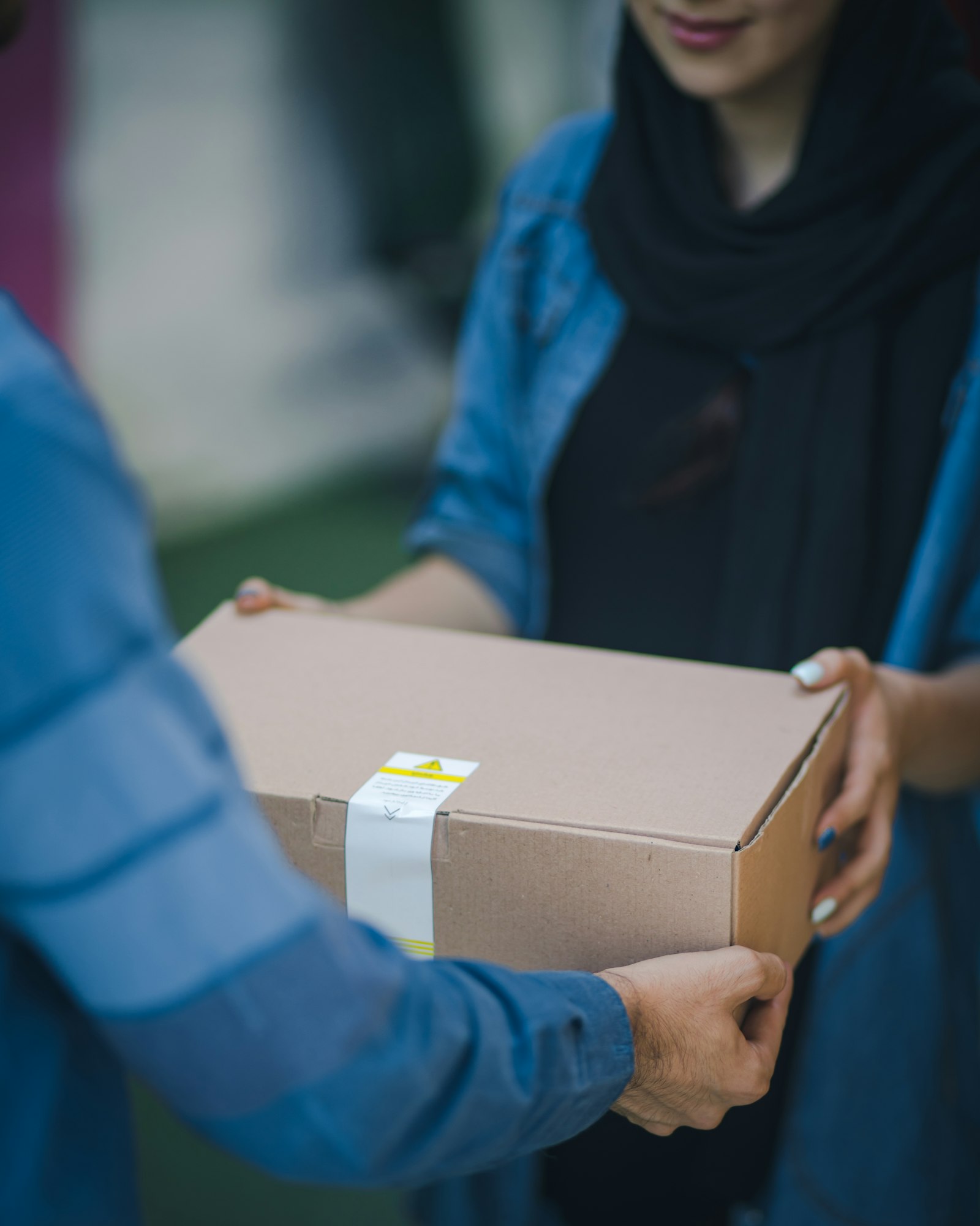 Courier handing over a parcel