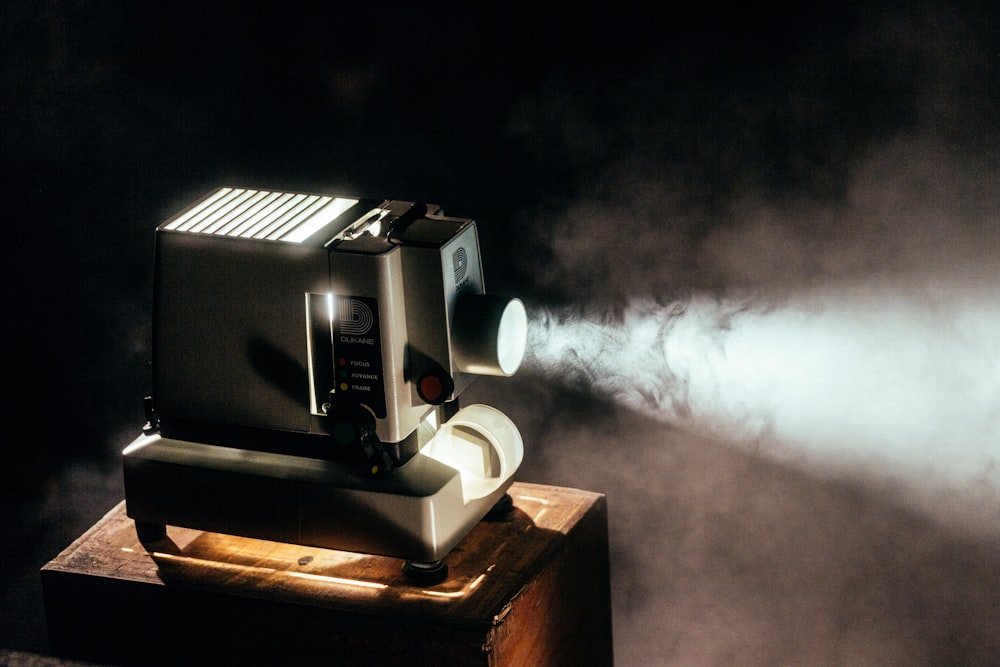 Film projector cutting through smoke